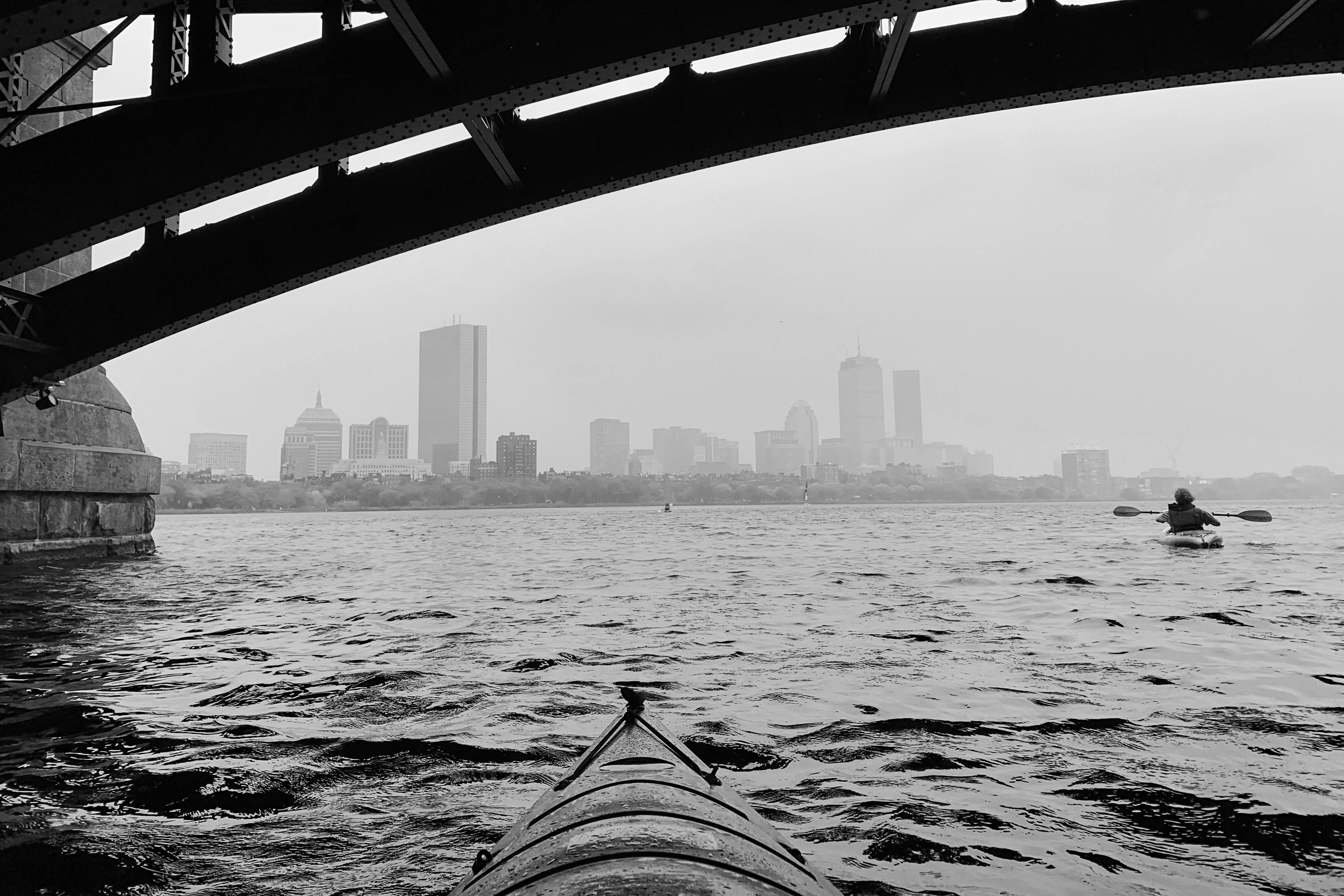View of Boston skyline from kayak on the Charles River